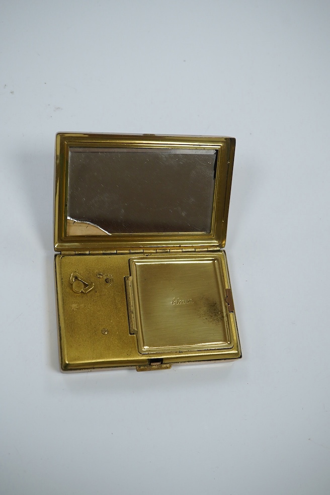 A Japanese damascened iron and gilt metal musical compact, 9cm wide. Condition - poor